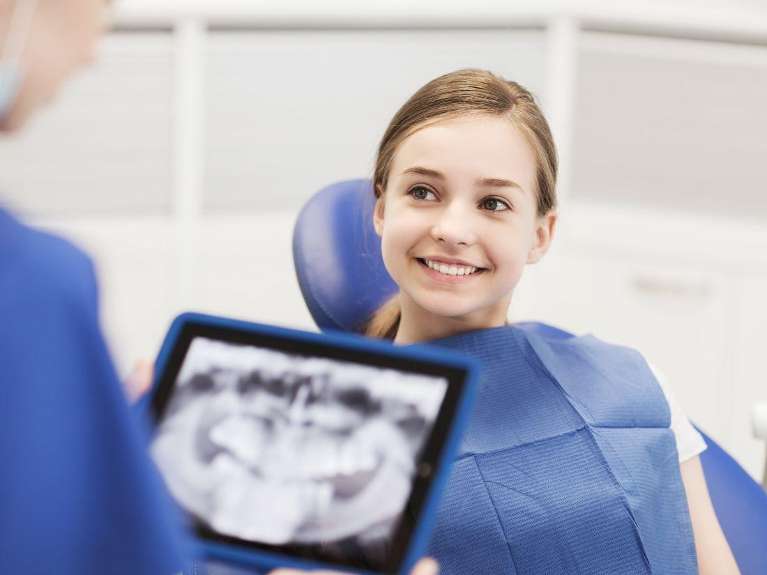 patient looking at digital x-ray | cosmetic dentist lara