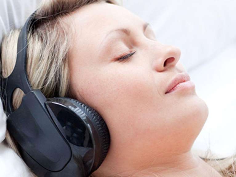 patient wearing headphones | lara dental clinic